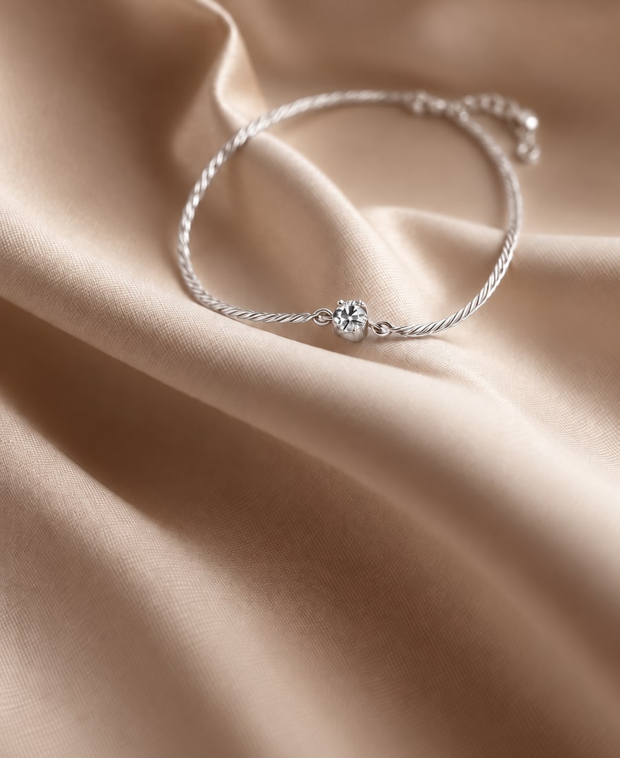 Petite Chain — A fine cable chain finished with a single bezel-set round diamond at the clasp.