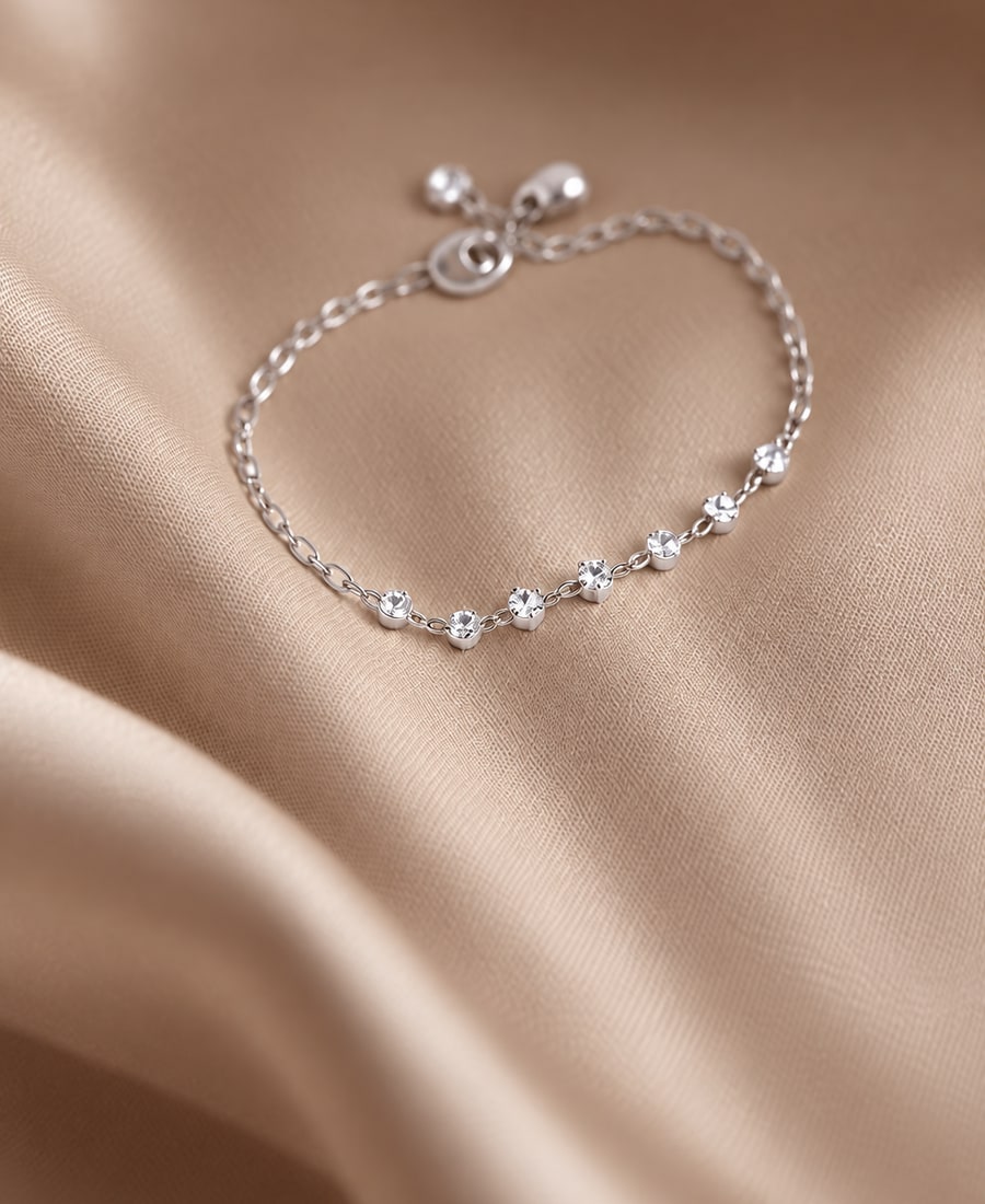 Constellation — Round brilliant diamonds bezel-set at scattered intervals along a fine chain.
