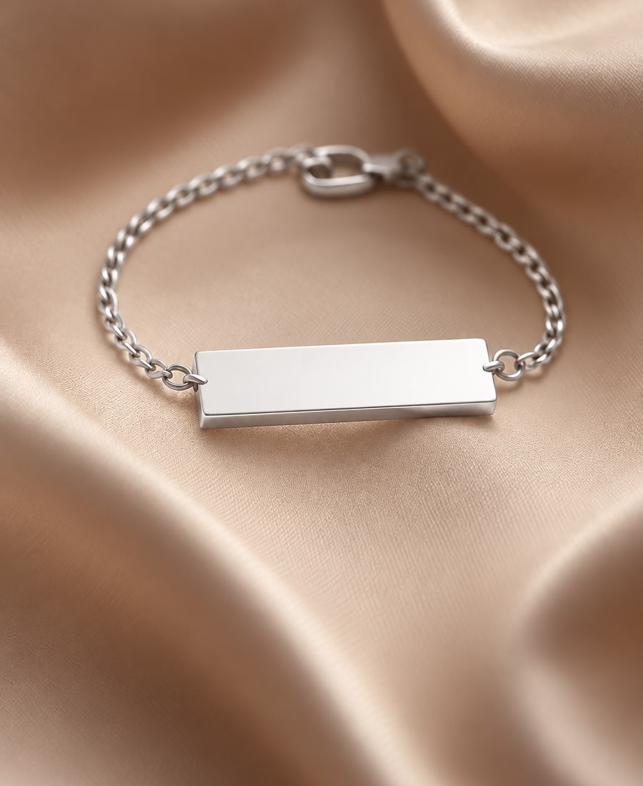 Bar Bracelet — A smooth engravable bar on an adjustable chain, finished by hand.